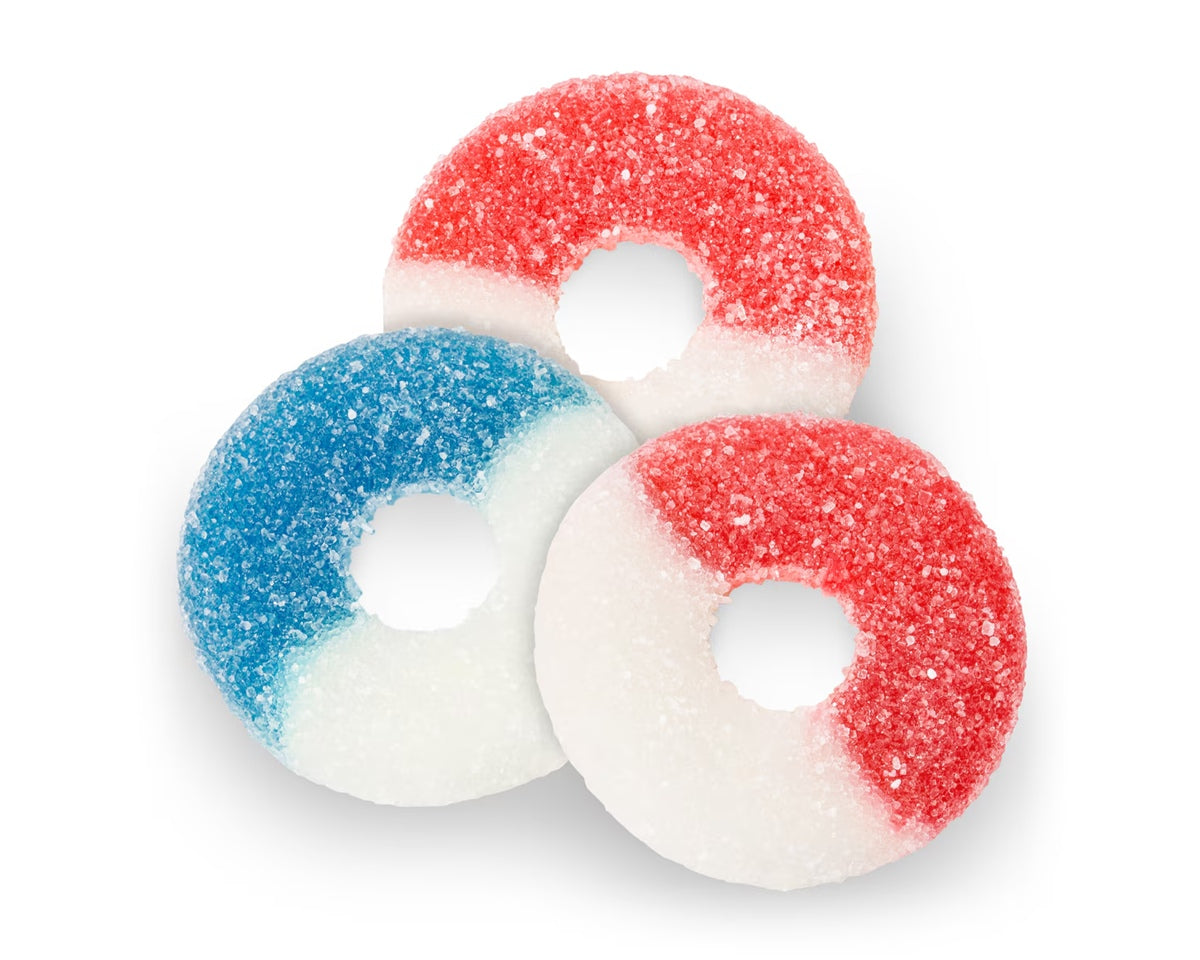 Three gummy candy rings in red, white, and blue on a white background