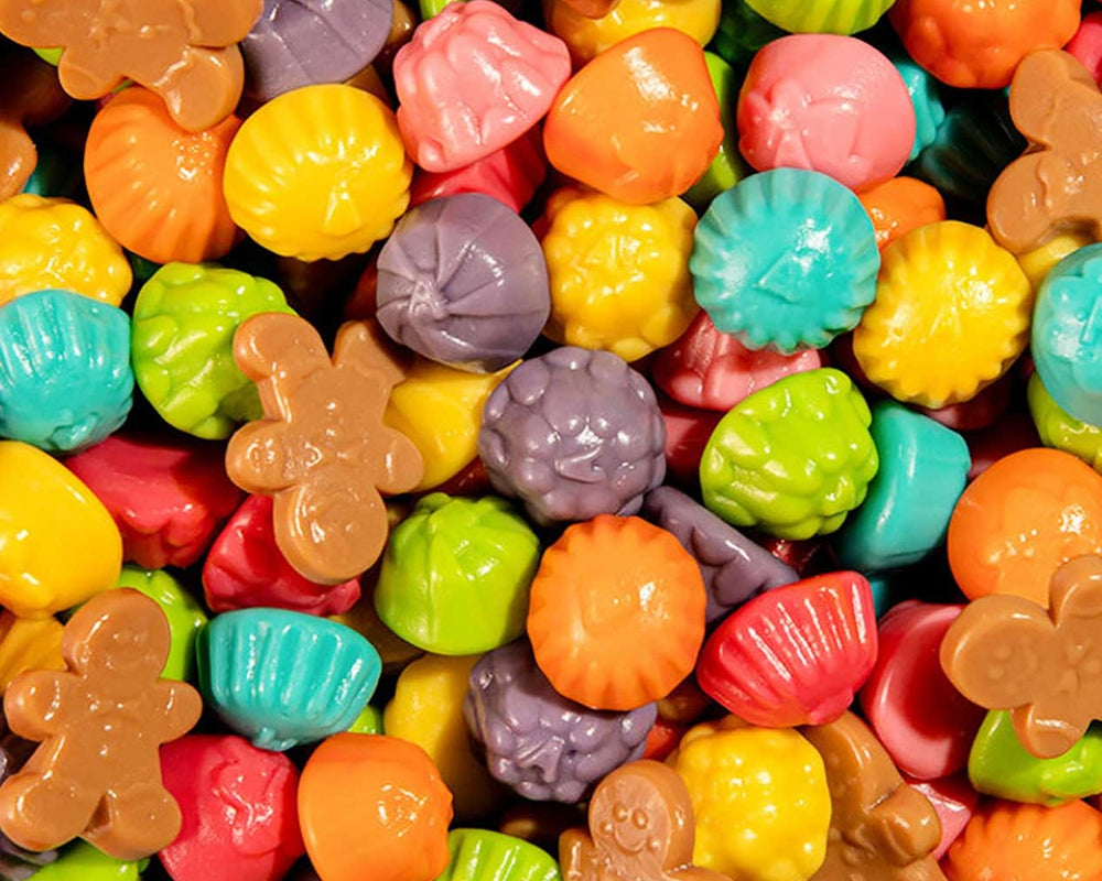Assorted colorful candy pieces including gingerbread men and various shapes.