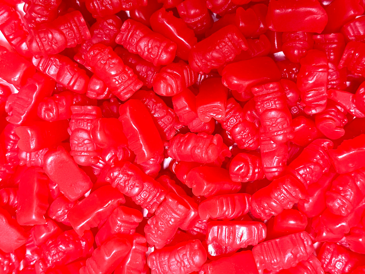 Close-up of red cinnamon gummySantas
