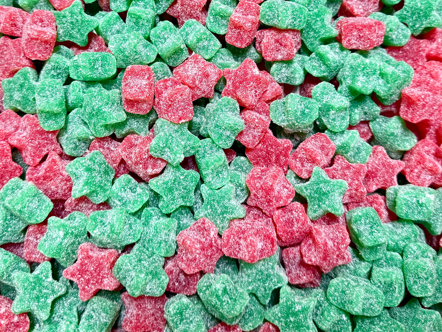 Mix of red and green star-shaped candies.